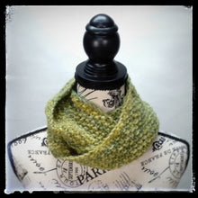 Load image into Gallery viewer, &quot;Meadow&quot; Hand Knit Twisted Infinity Scarf was created with Berroco Air blown bulky weight yarn in Geothermal colorway, worn wrapped.
