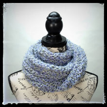 Load image into Gallery viewer, &quot;Spring&#39;s Promise&quot; Hand Knit Twisted Infinity Scarf was created with Loops &amp; Threads Country Loom soft and cozy Super Bulky acrylic yarn in Lavender Blues colorway, worn wrapped.
