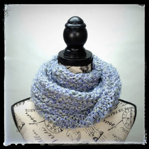 "Spring's Promise" Hand Knit Twisted Infinity Scarf was created with Loops & Threads Country Loom soft and cozy Super Bulky acrylic yarn in Lavender Blues colorway, worn wrapped.